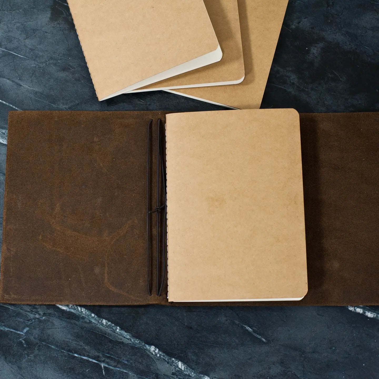 open blank notebook on desk, customizable journal for branding and promotional merchandise