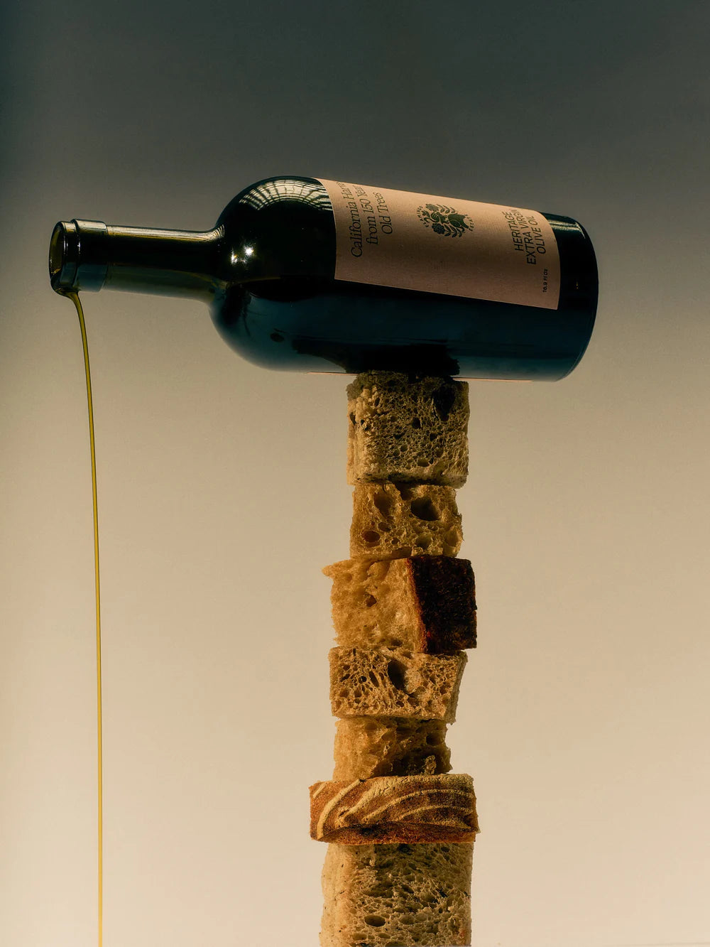 oil bottle with cork stopper on a plain background