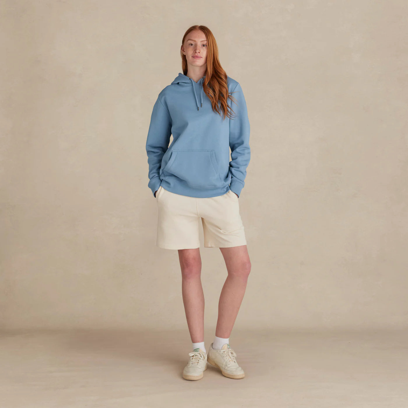 EMERCYN Essential Hoodie – light blue women’s premium cotton hoodie styled on male model