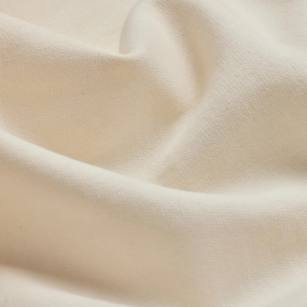 EMERCYN Essential Hoodie – premium cotton fabric detail in forest green