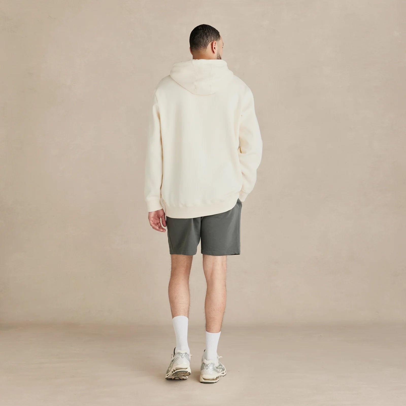 EMERCYN Essential Hoodie – cream men’s premium cotton hoodie styled on male model
