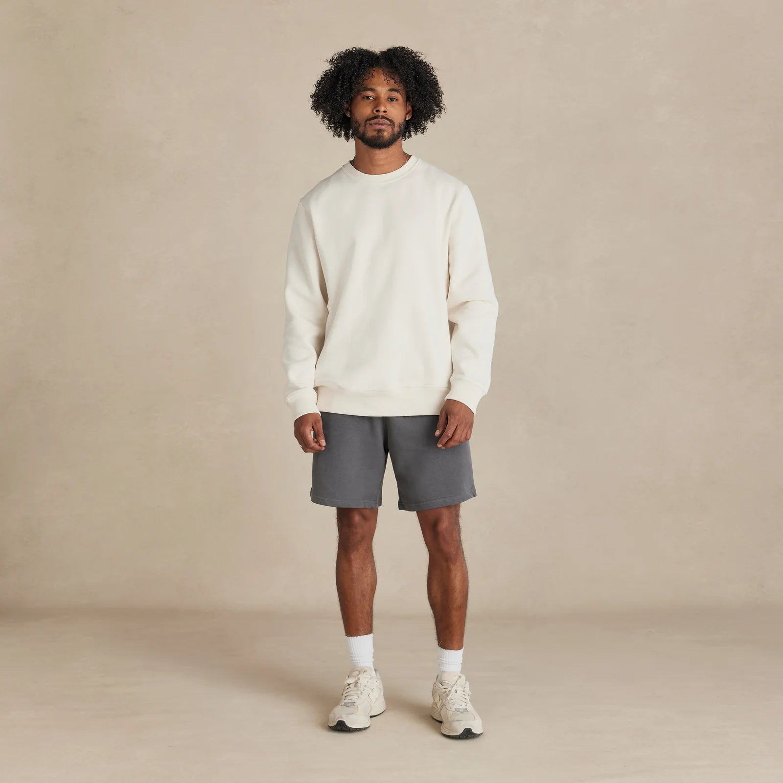 EMERCYN Essential Crewneck – white unisex premium cotton sweatshirt worn by model
