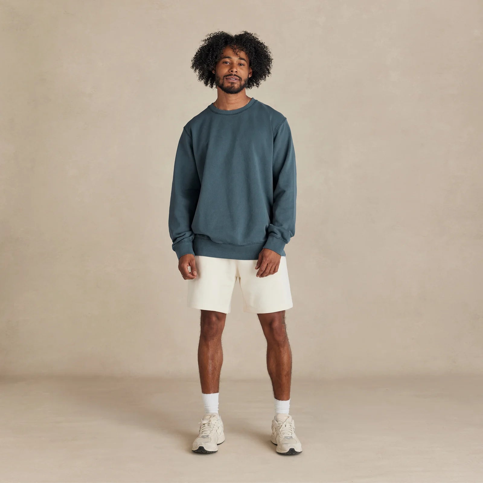 The Classic Crewneck deep teal sweatshirt worn by male model front view
