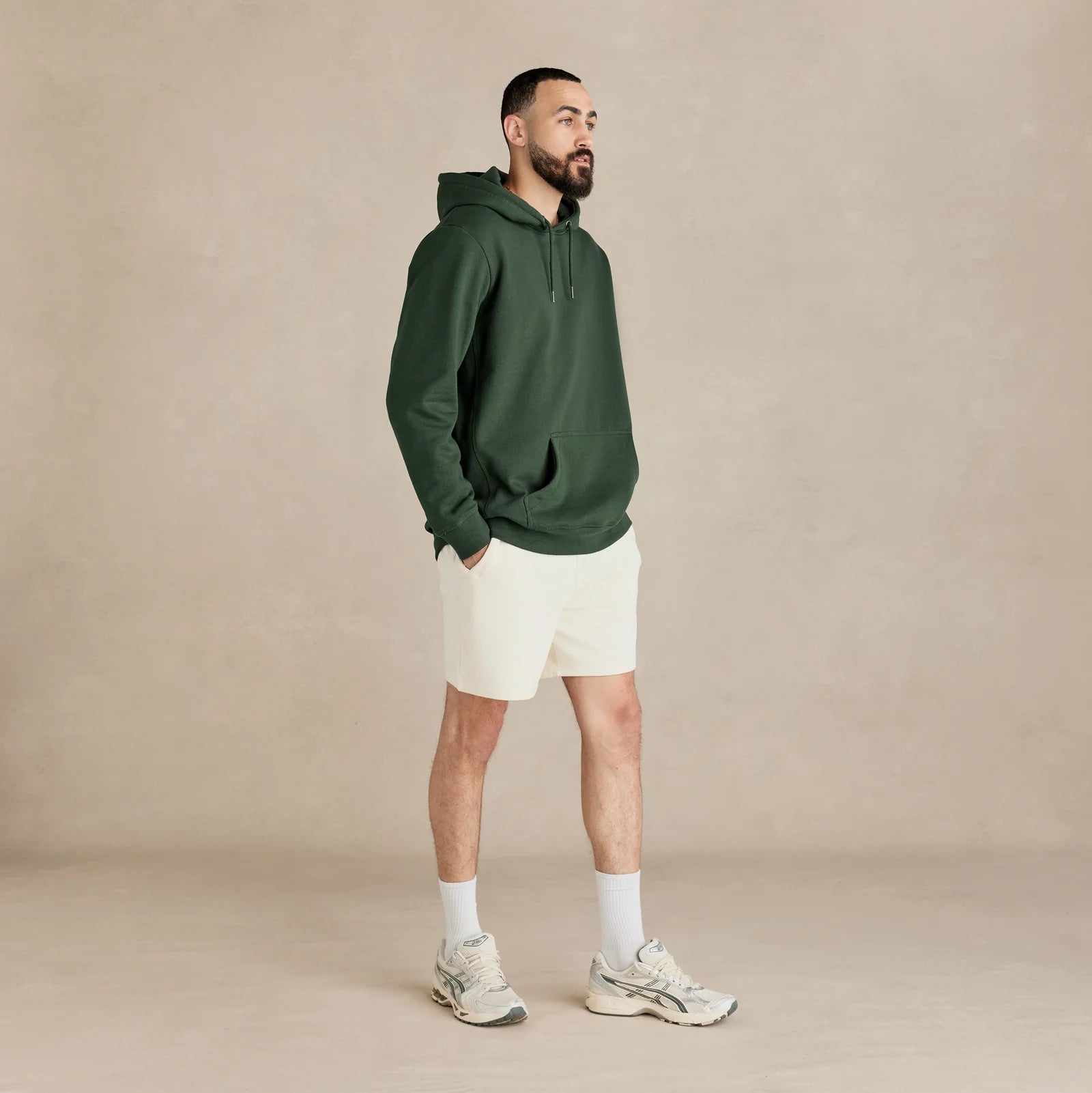 EMERCYN Essential Hoodie – forest green men’s premium cotton hoodie styled on male model