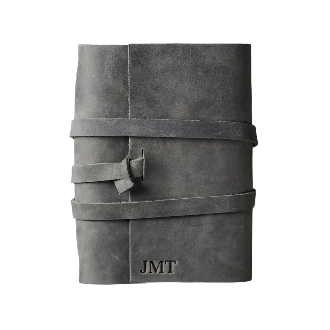 gray leather notebook cover detail, custom embossed logo journal merchandise