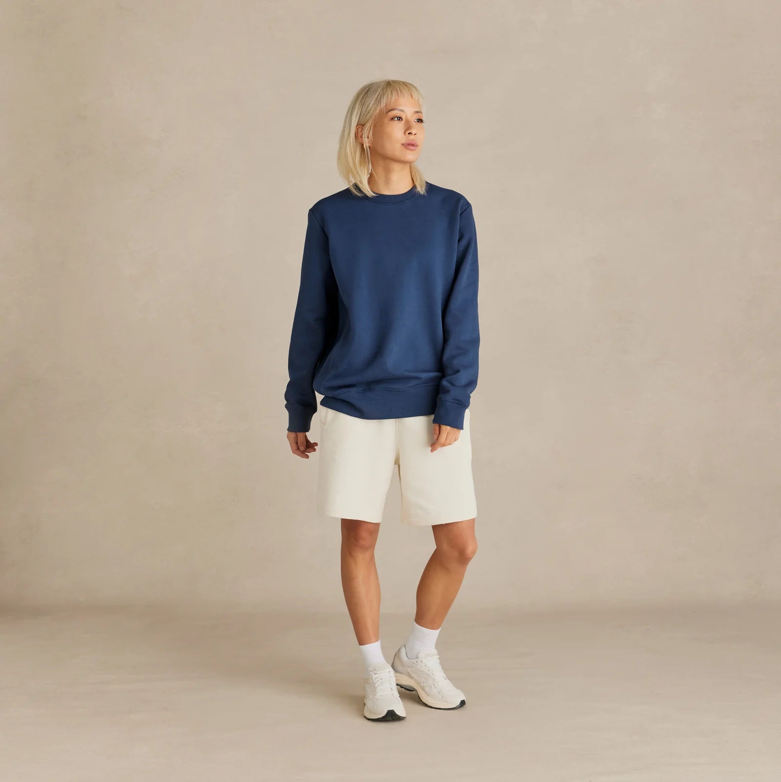 EMERCYN Essential Crewneck – navy blue unisex sweatshirt styled in lifestyle look