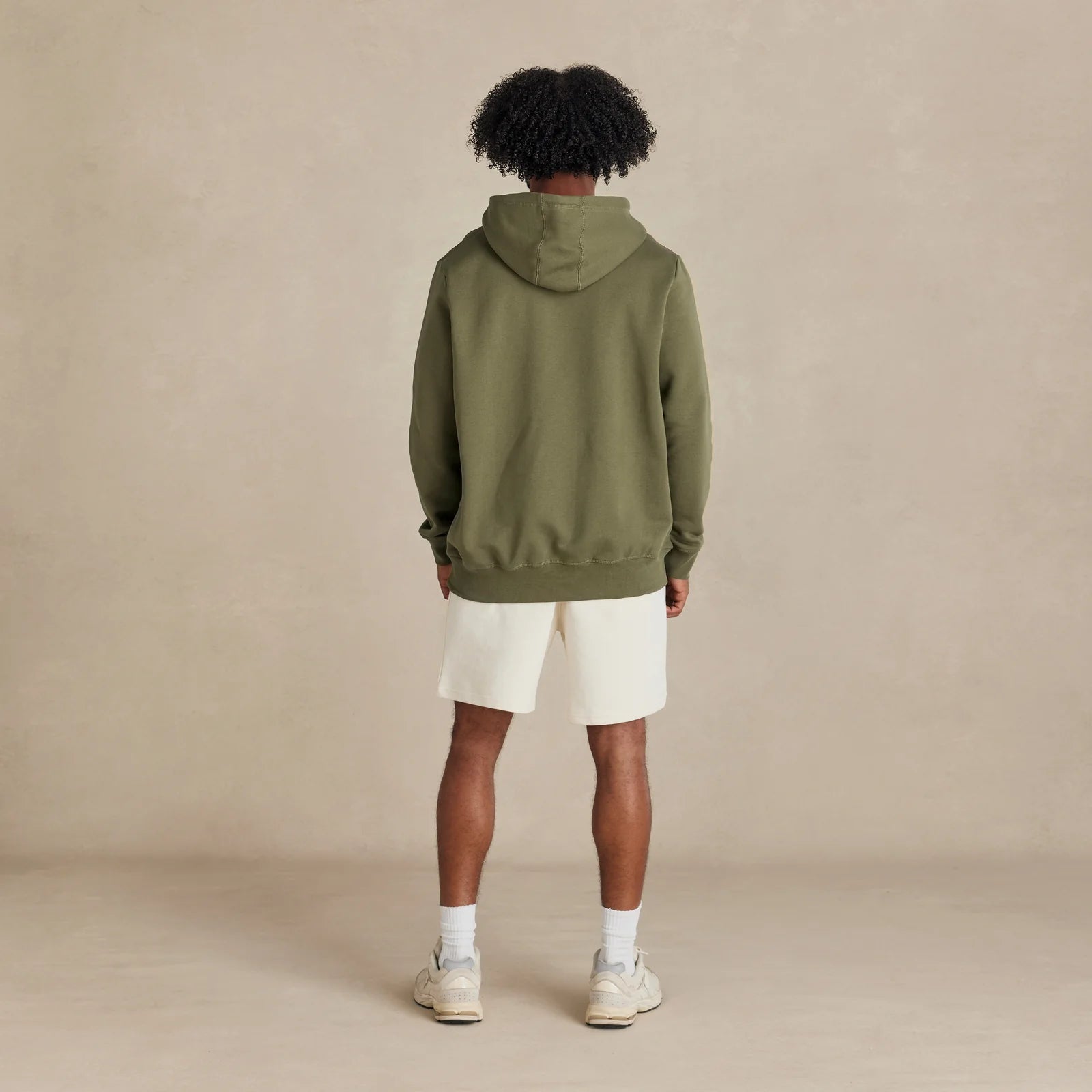 EMERCYN Essential Hoodie – olive men’s premium cotton hoodie styled on male model