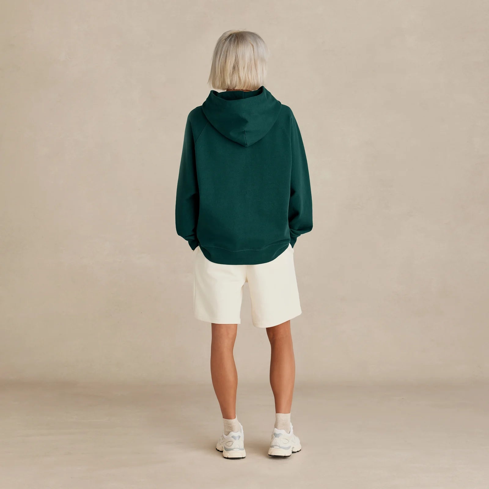 Unisex pine green oversized hoodie on model