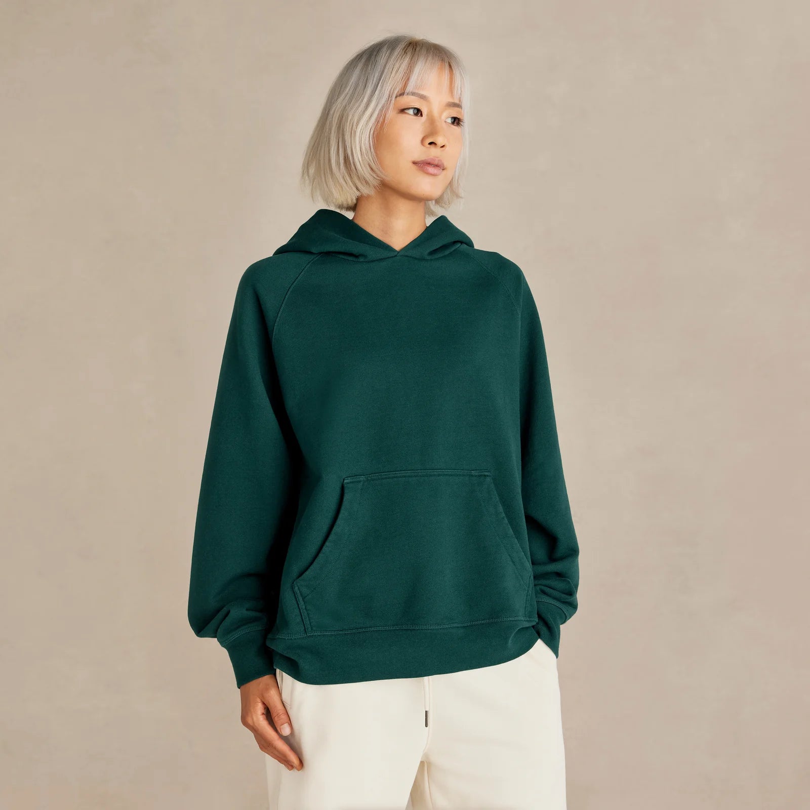 Unisex pine green oversized hoodie on model