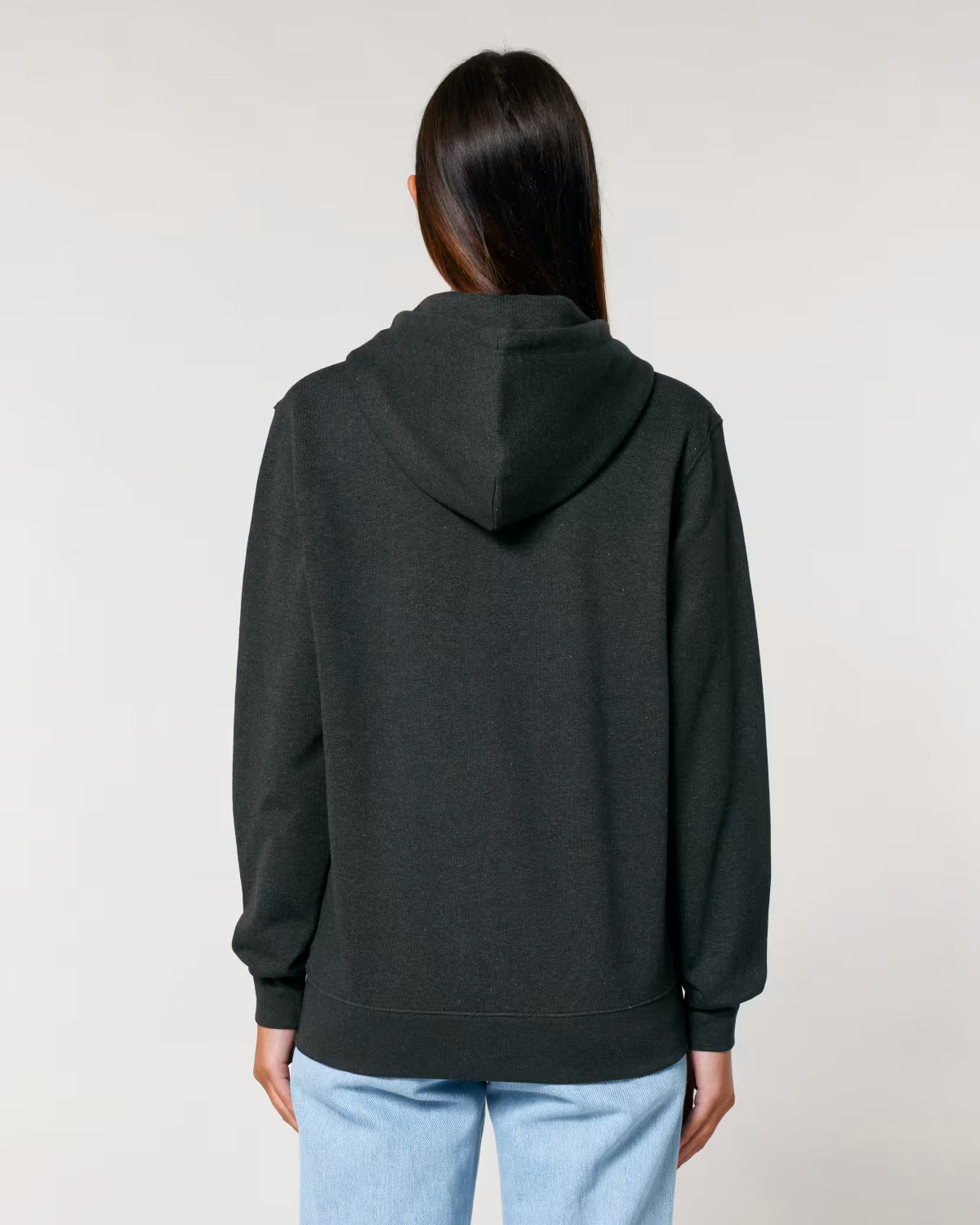 Back view of a male model wearing a black cotton hoodie in studio