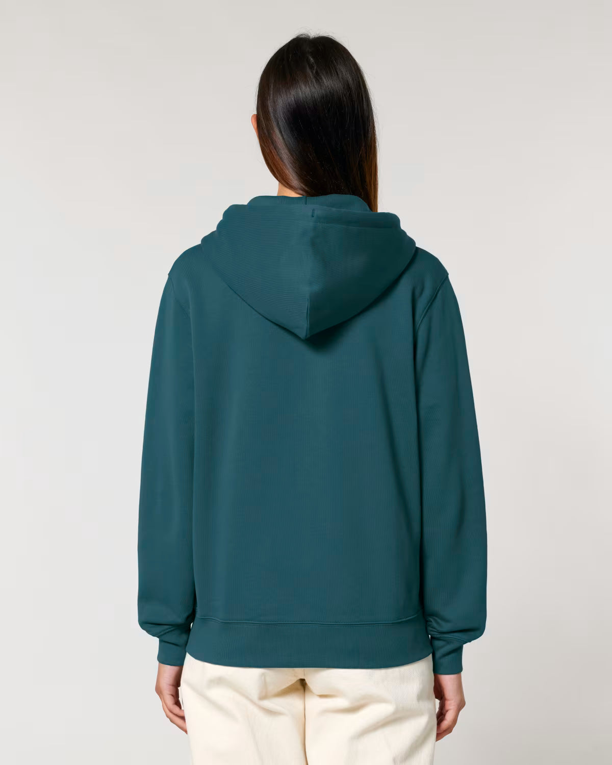 Person wearing unisex cotton a teal hoodie from behind on a white background