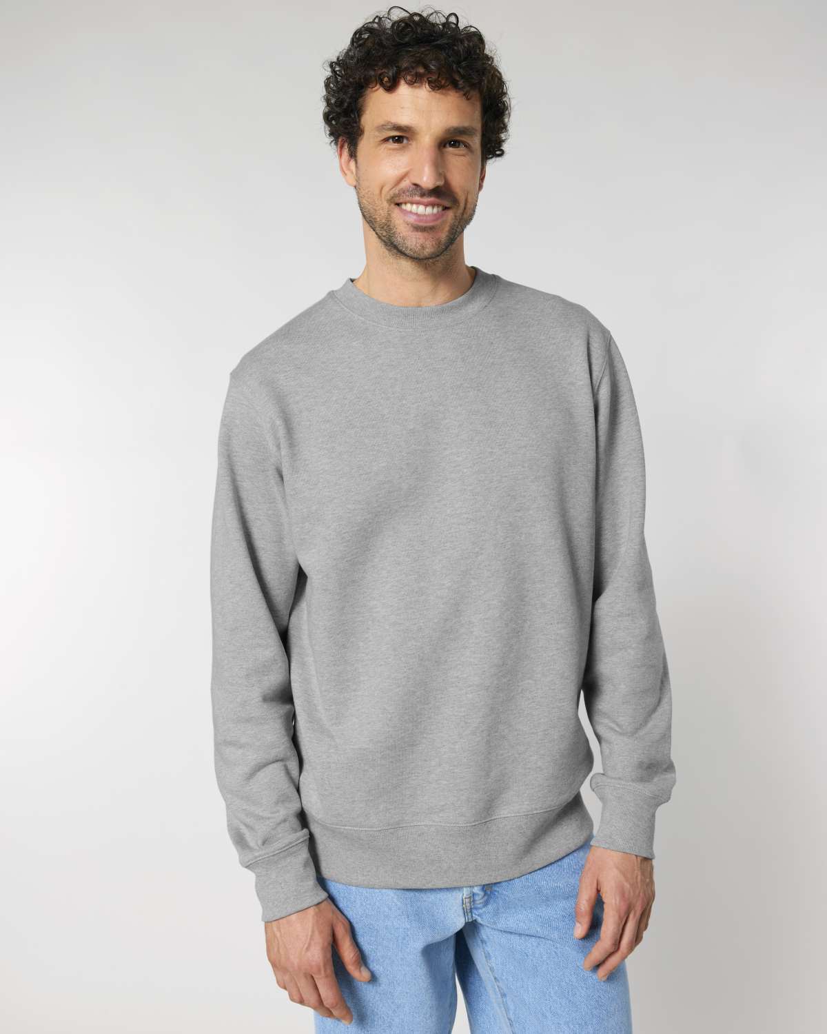 Man wearing a gray unisex cotton hoodie isolated on white background