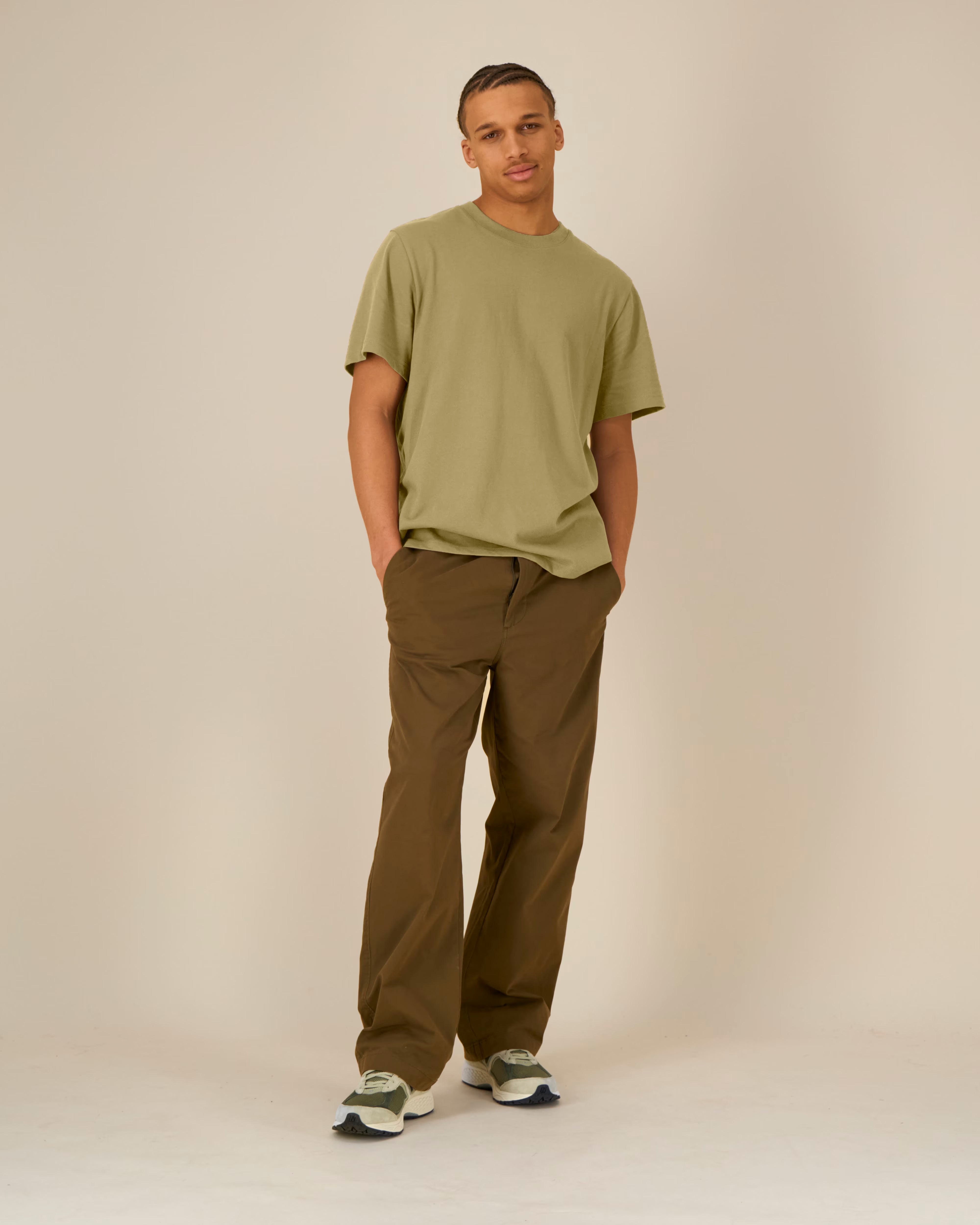 olive green unisex cotton t-shirt on model, full body