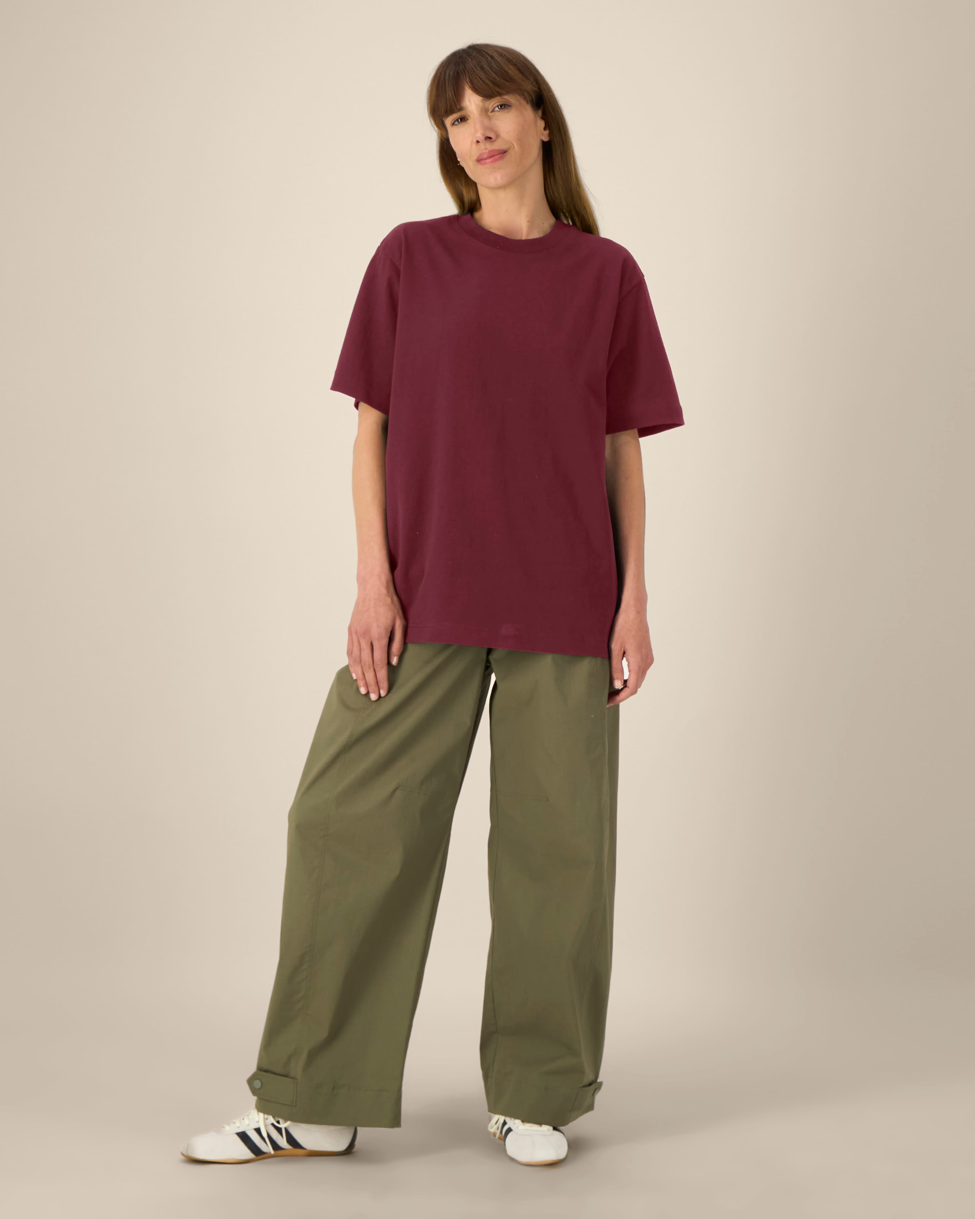 deep burgundy unisex cotton t-shirt on model, relaxed fit