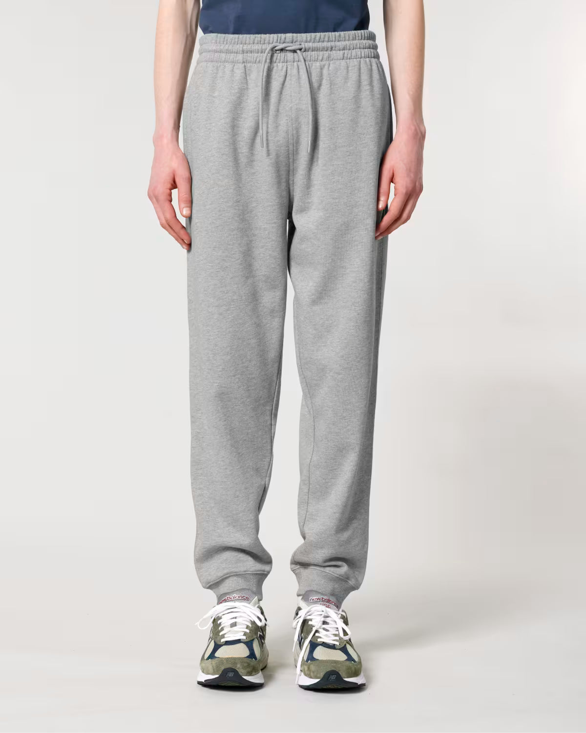 light grey unisex jogger pants front view on model, sustainable cotton custom apparel