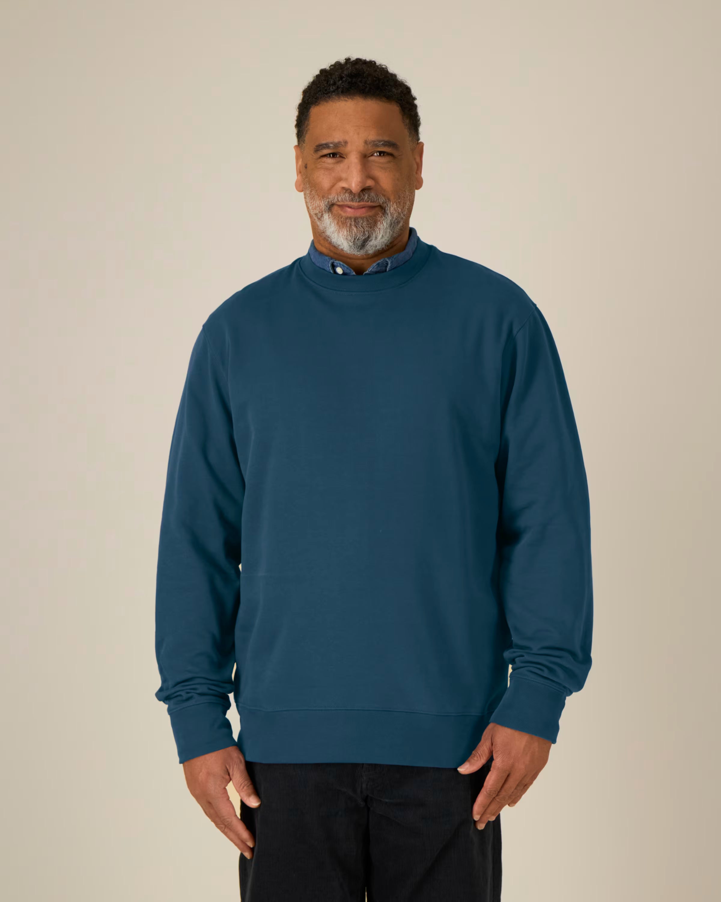 deep navy unisex crewneck sweatshirt on model, relaxed fit