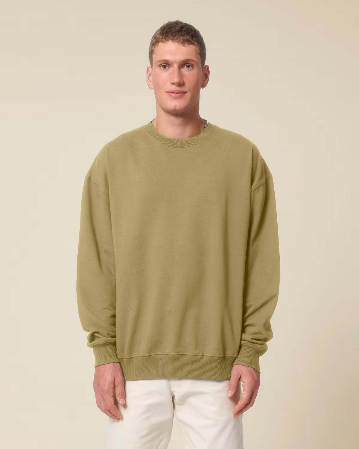 Front view of a male model wearing an olive green cotton hoodie in studio