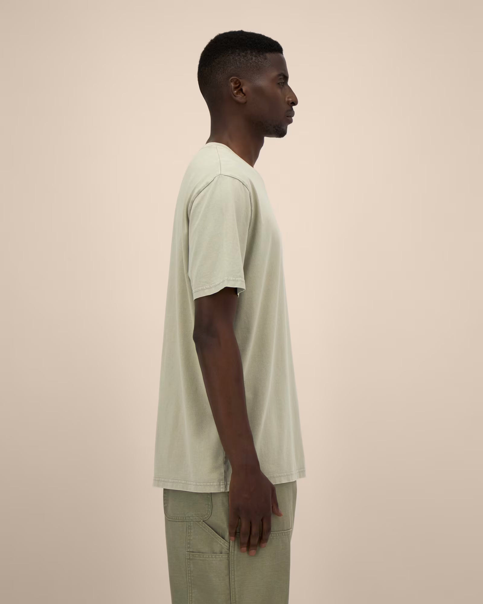 light sage green unisex cotton t-shirt on model