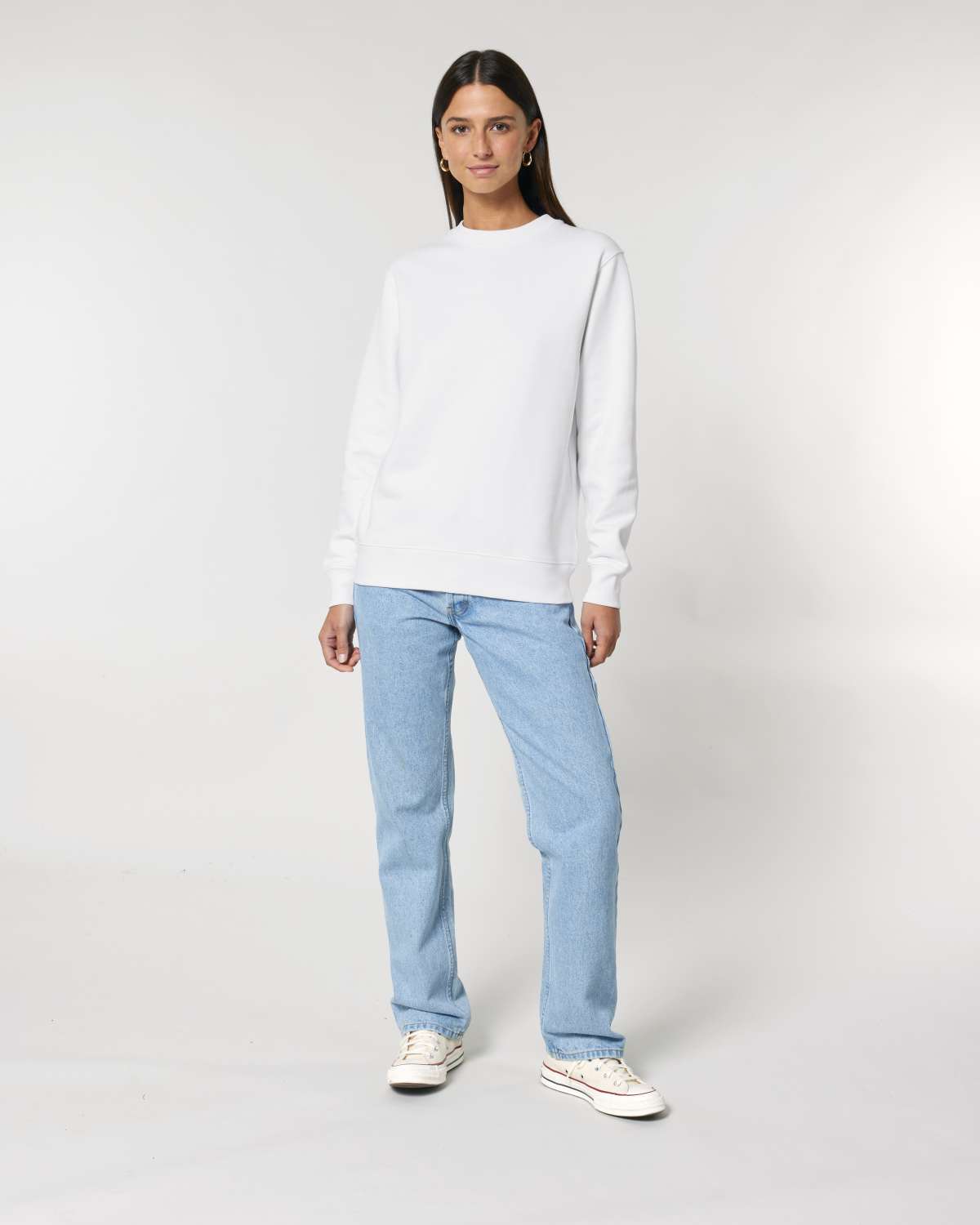 Person wearing a white unisex cotton hoodie isolated on white background