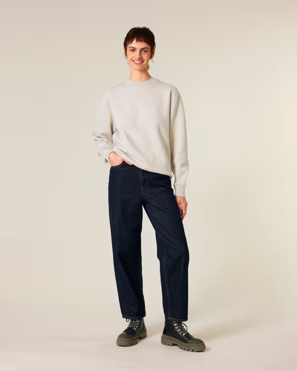 light beige unisex crewneck sweatshirt on model, relaxed fit