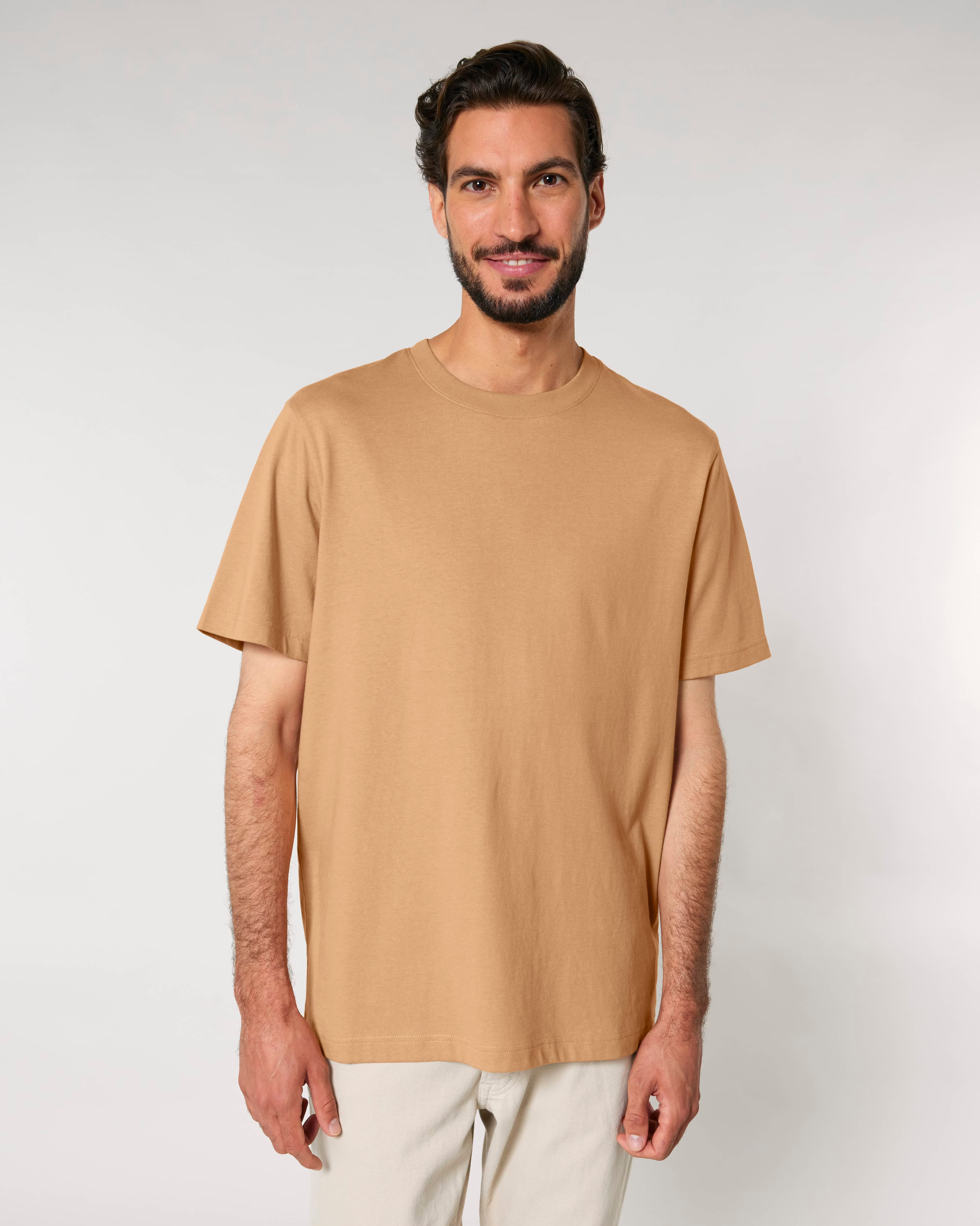 woman wearing warm sand colored cotton t-shirt, sustainable organic apparel
