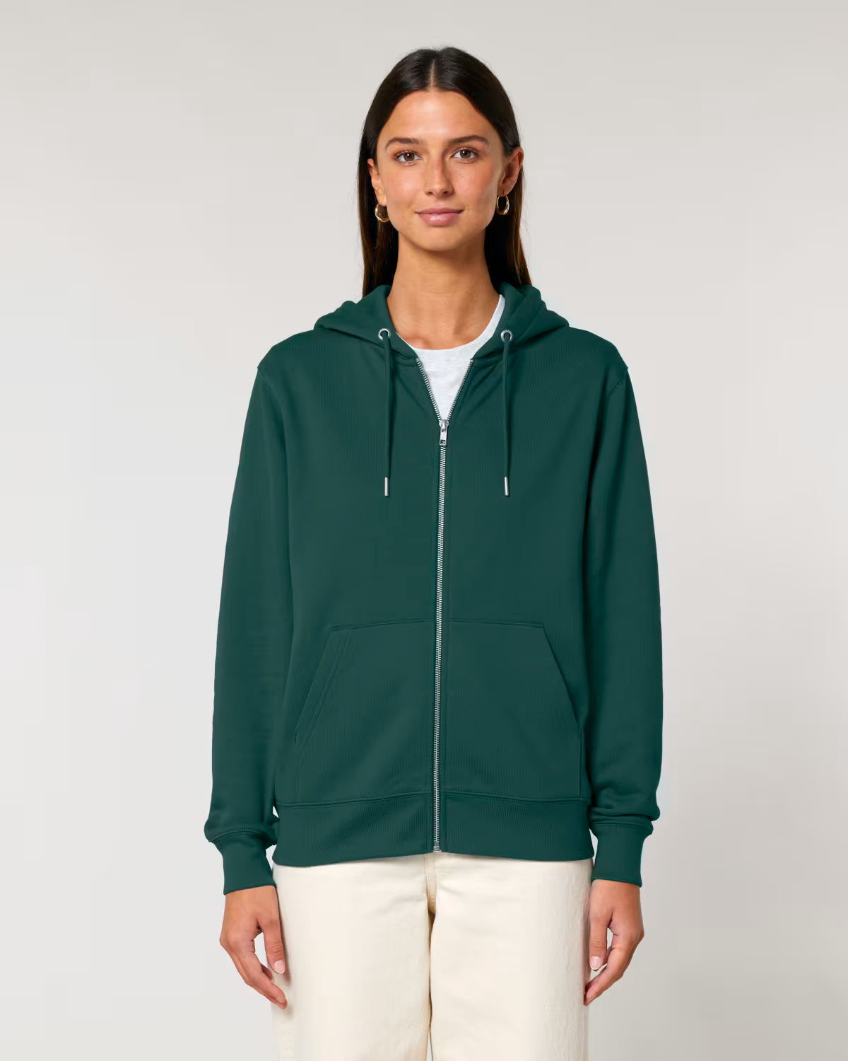 Woman wearing a green hoodie on a plain background ideal for customization and printing