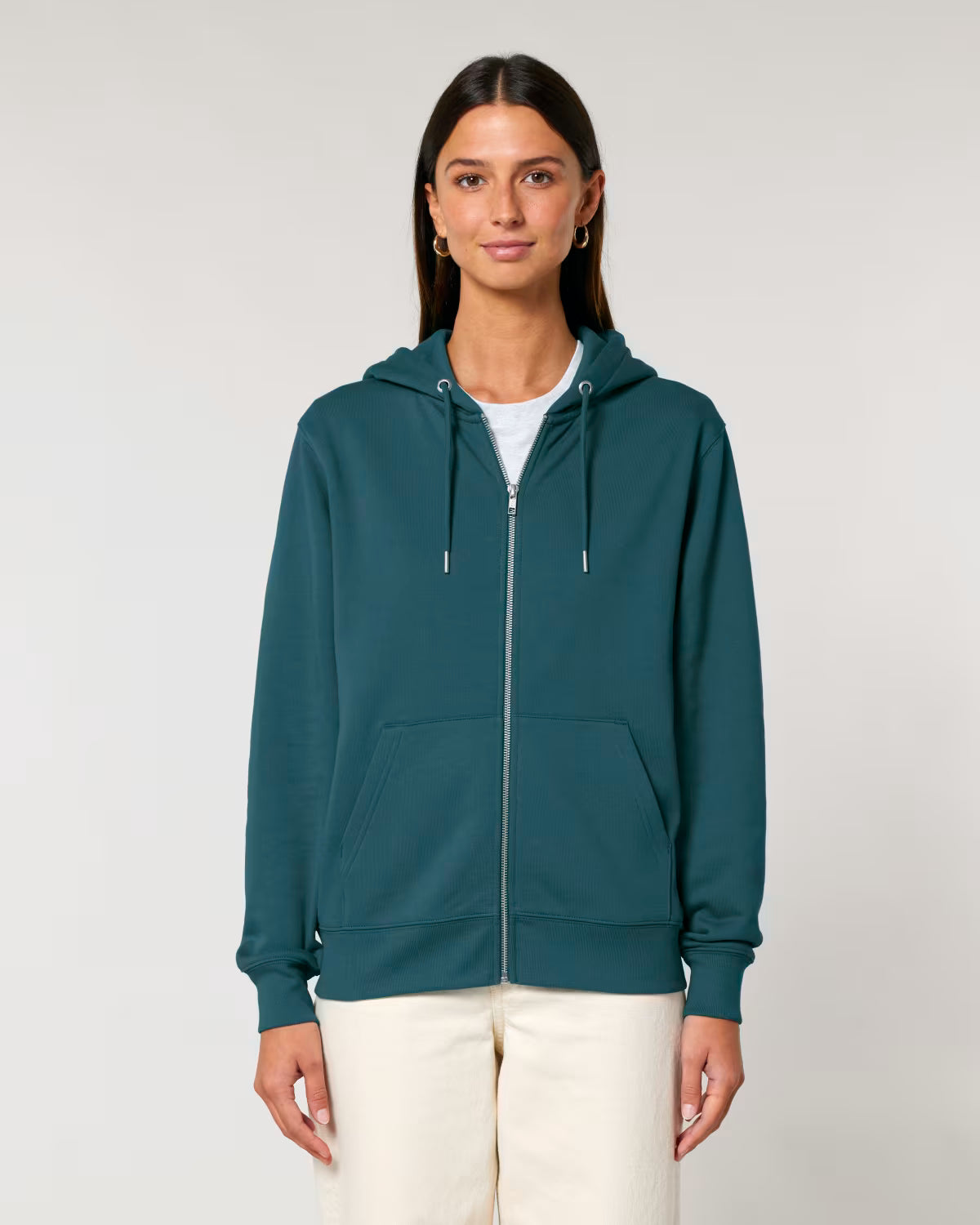 Woman wearing a teal hoodie on a plain background ideal for customization and printing