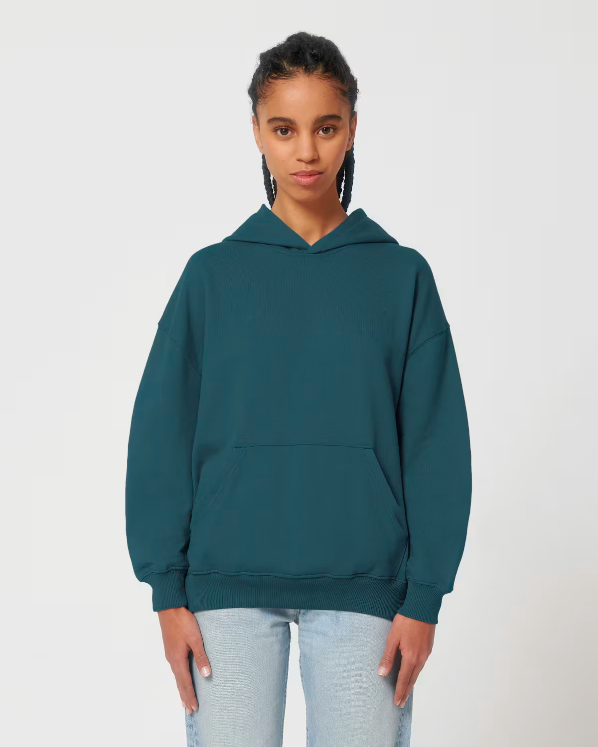 Front view of a male model wearing a teal cotton hoodie in studio