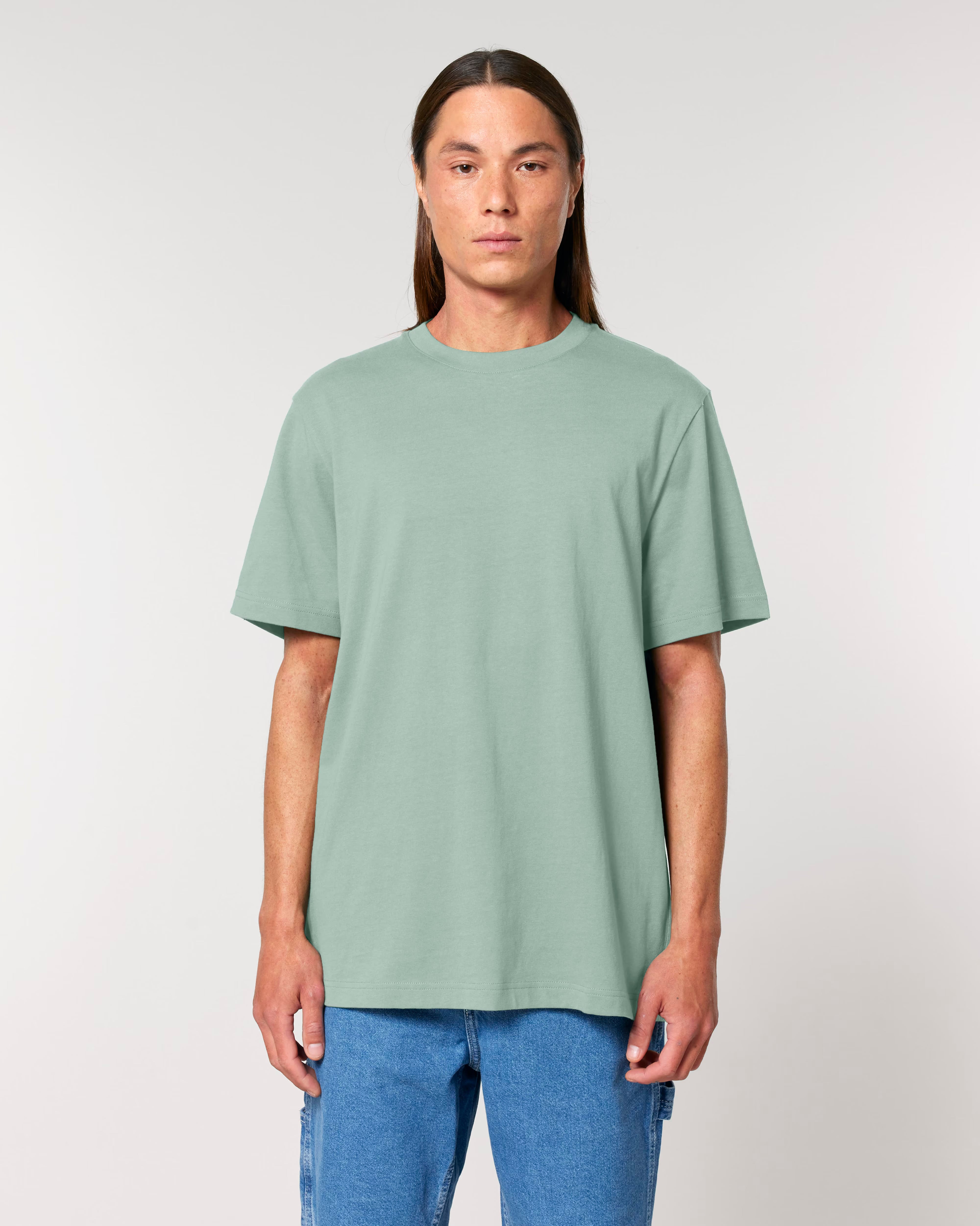 light sage green unisex cotton t-shirt on model, relaxed fit sustainable fashion