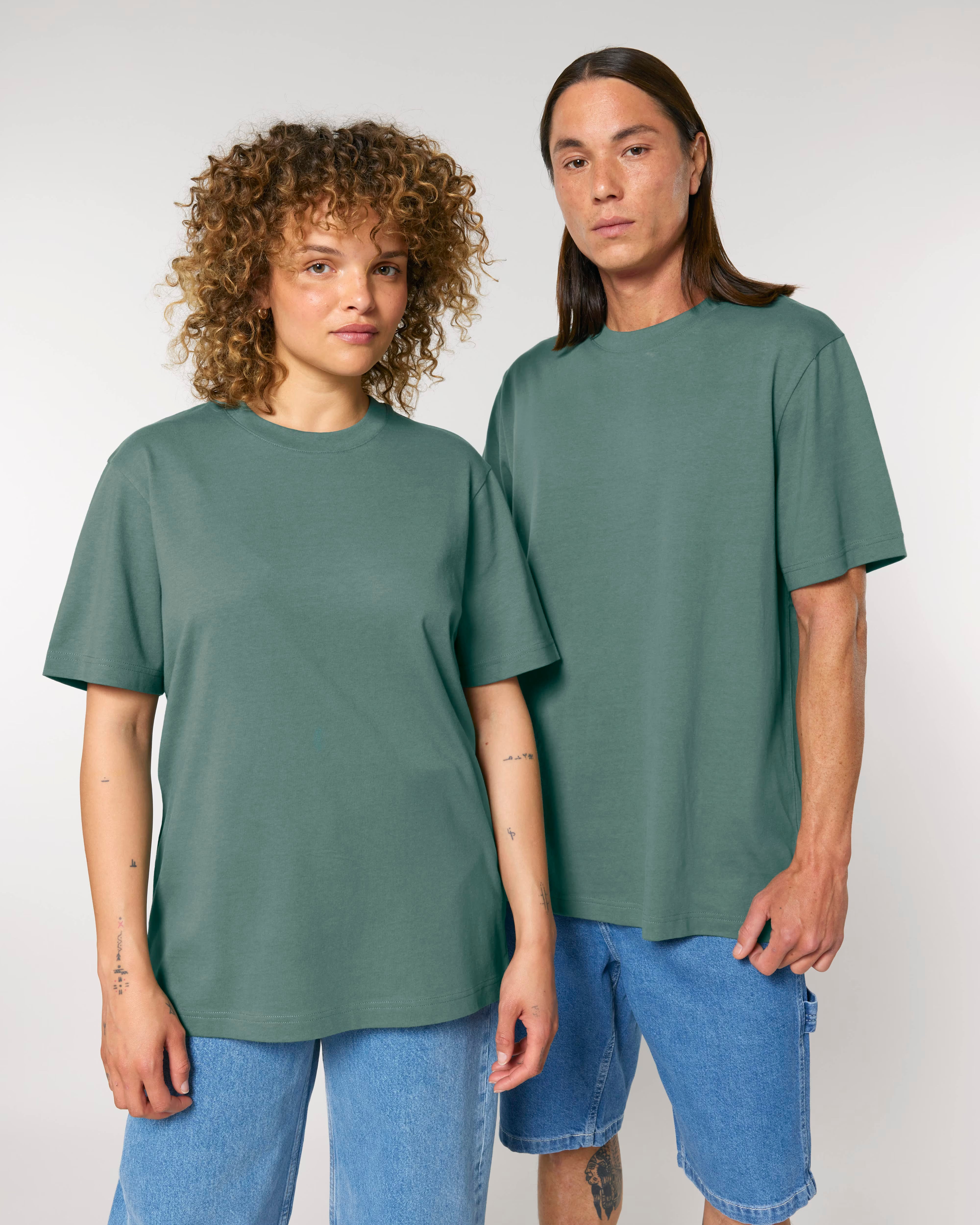 muted sage green unisex cotton t-shirt on model, sustainable everyday essential