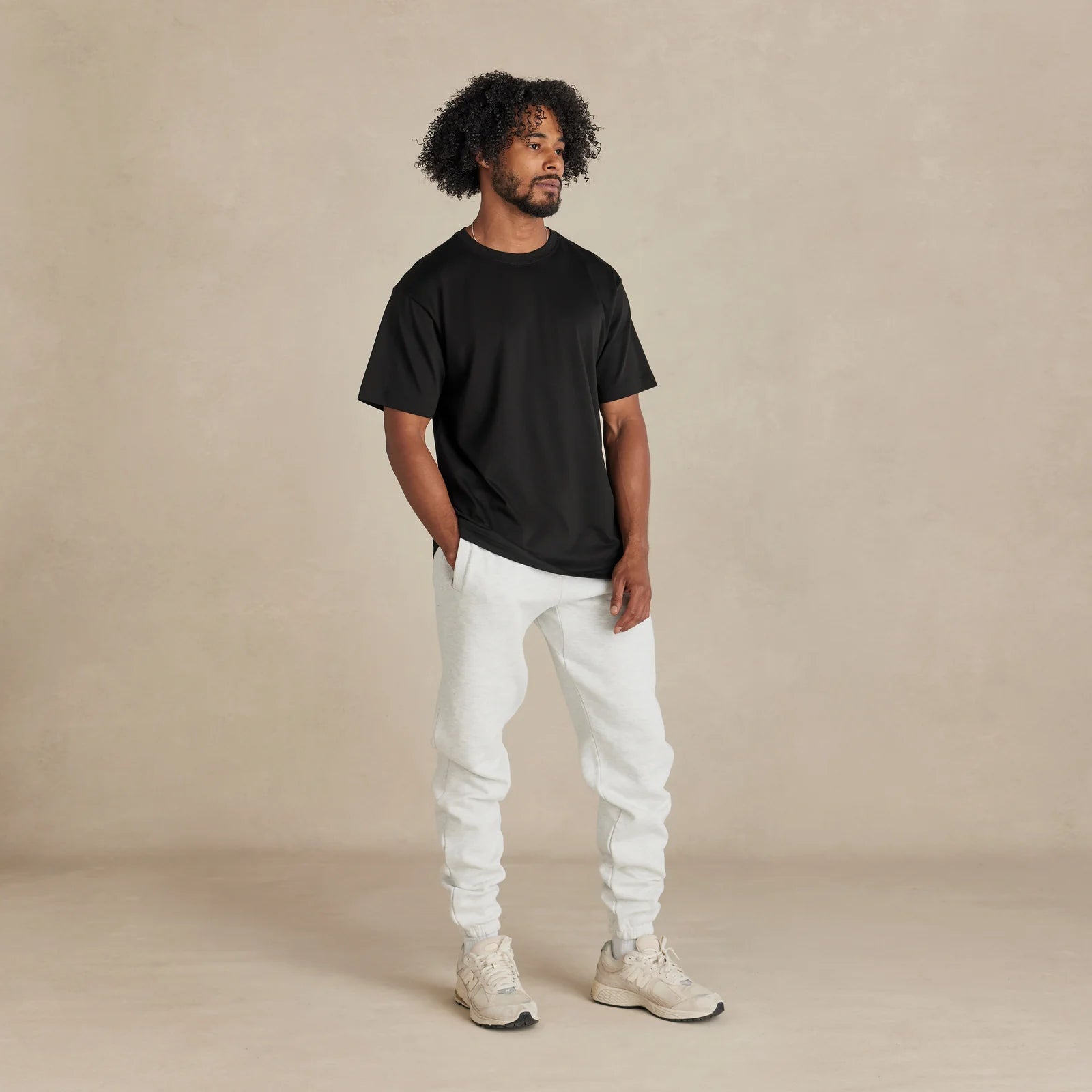 The Essential Jogger light grey sweatpants worn by female model