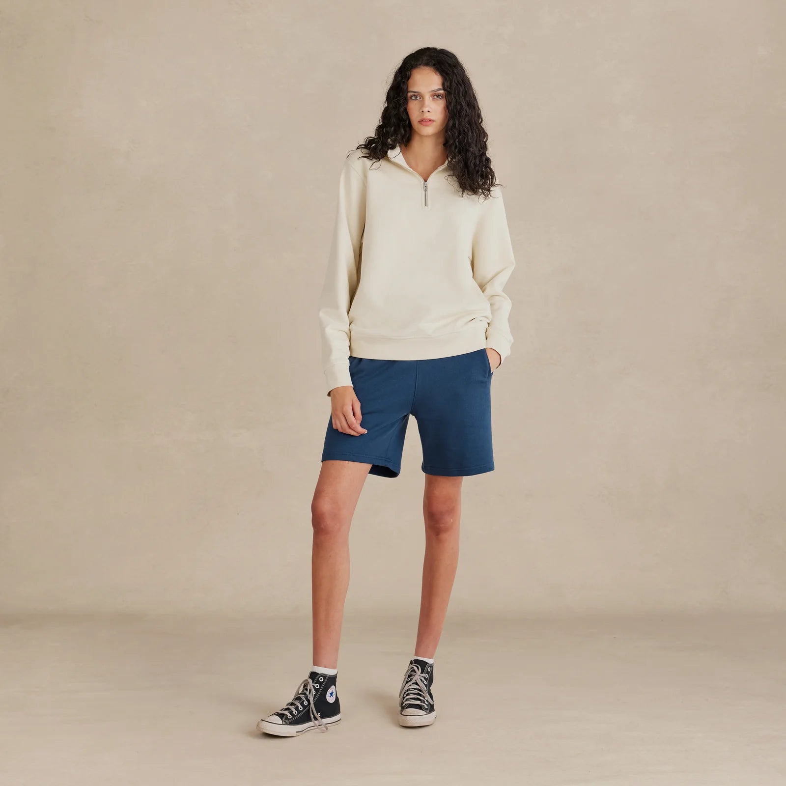 The Traveler Pullover oat sweatshirt worn by female model front view