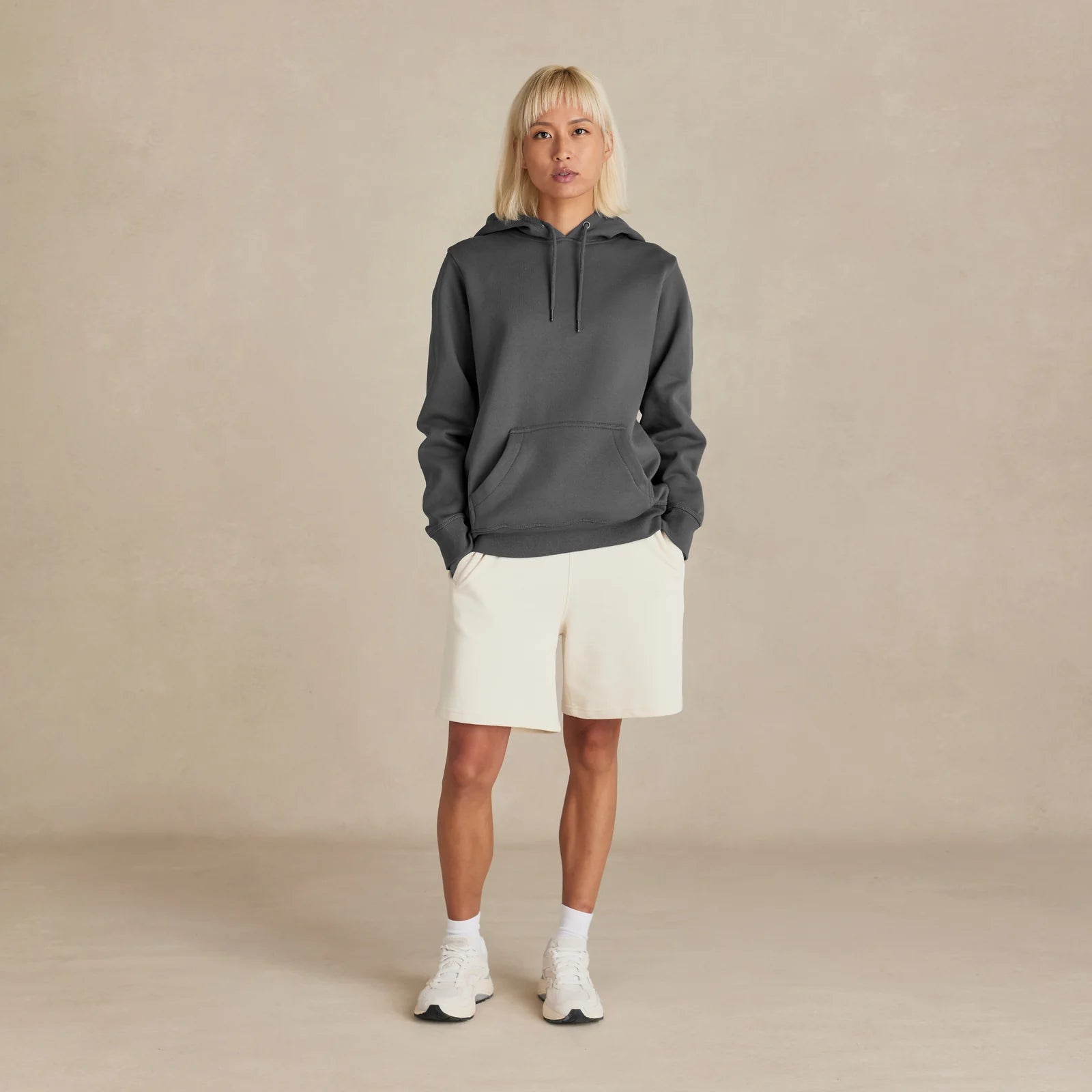 EMERCYN Essential Hoodie – dark grey women premium cotton hoodie styled on male model