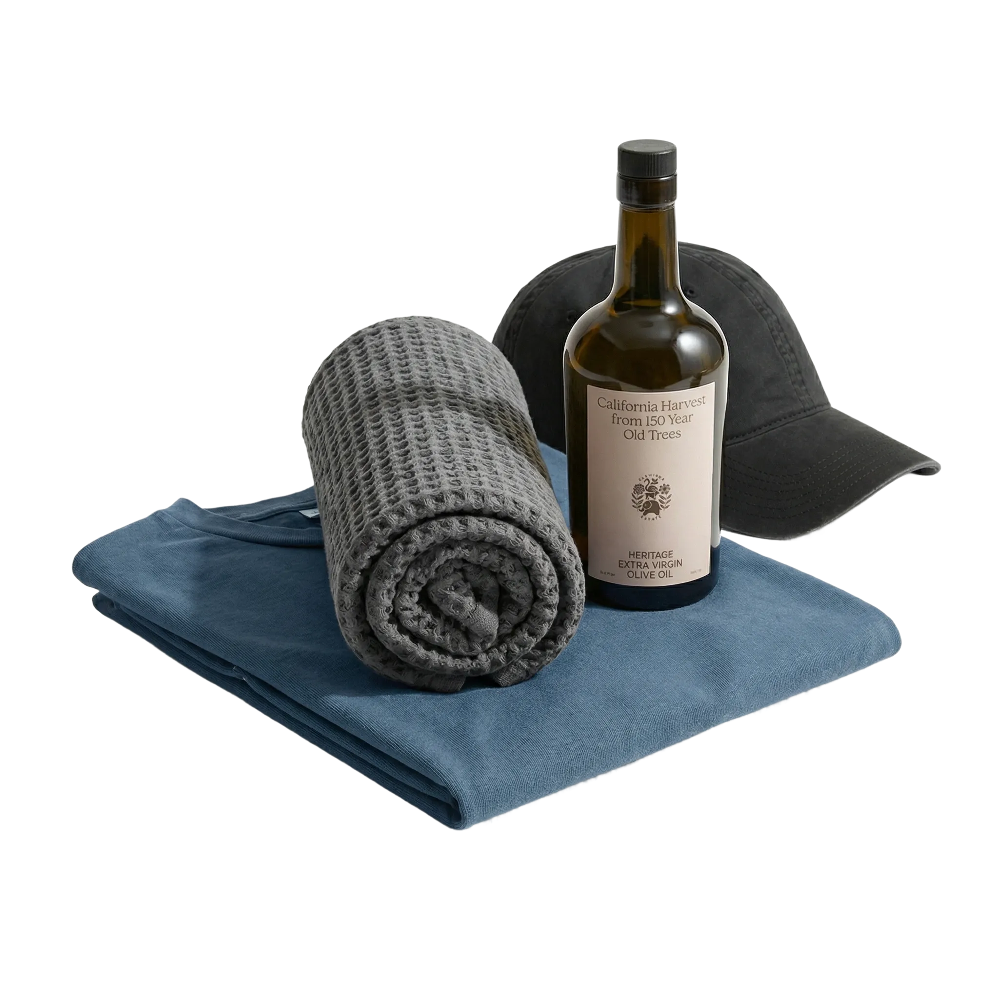 oil bottle, folded gray blanket, and blue towel on a white background