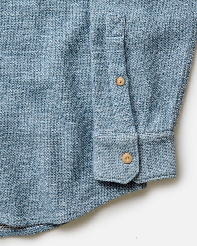 Indigo blue shirt cuff with button detail