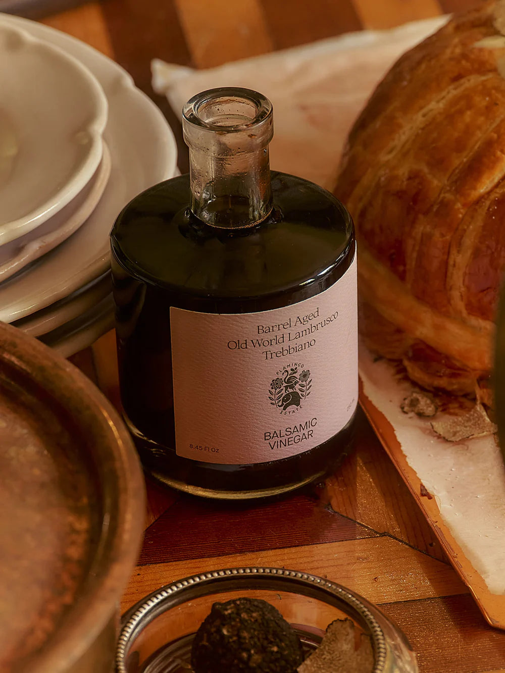 Flamingo Estate olive oil bottle styled on table, luxury extra virgin olive oil lifestyle photography