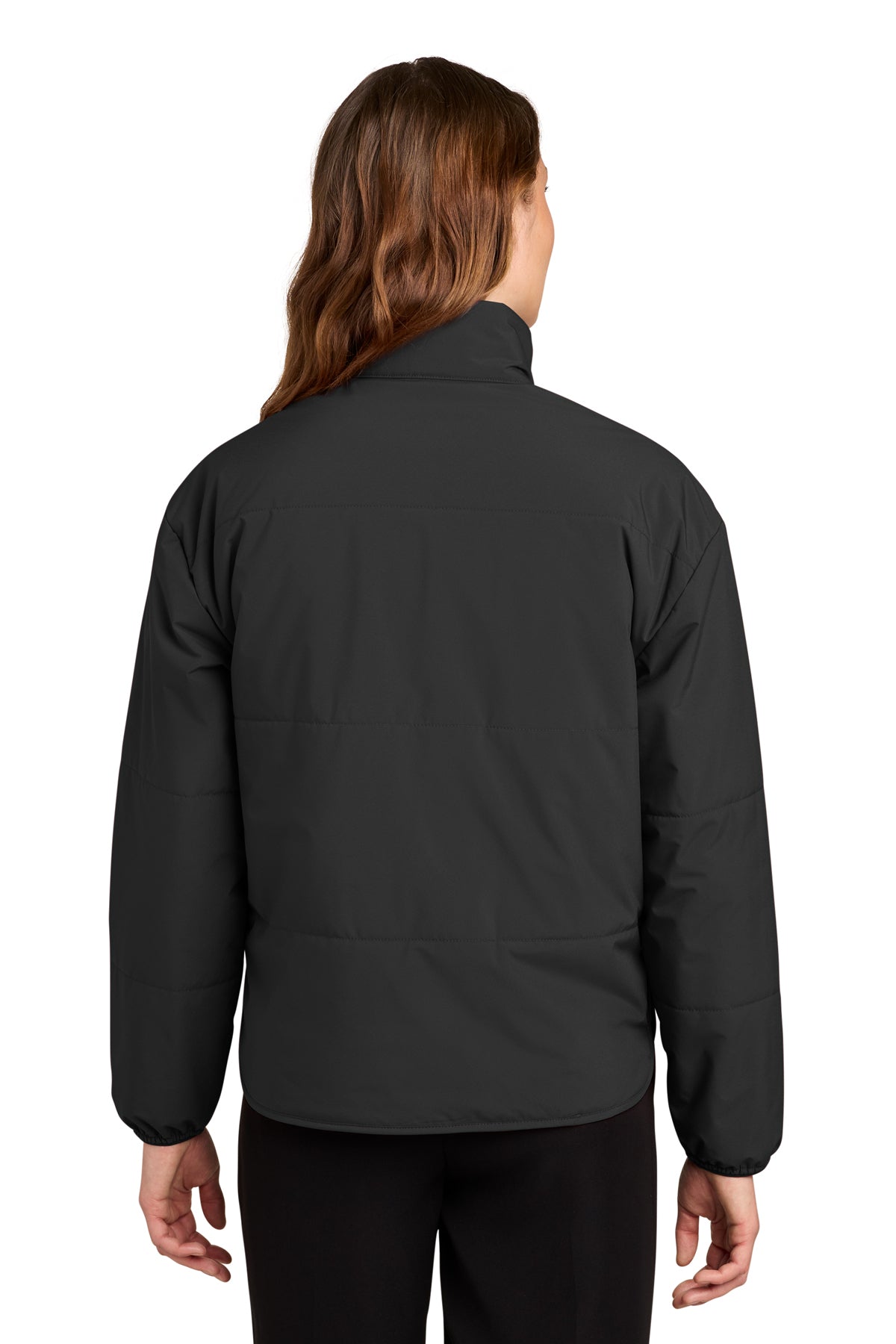 A person viewed from the back wearing a dark charcoal gray zip-front jacket and black pants against a plain white background.