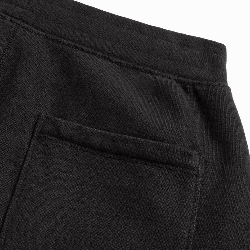 black jogger pants fabric detail close-up, premium cotton texture for sustainable custom merch