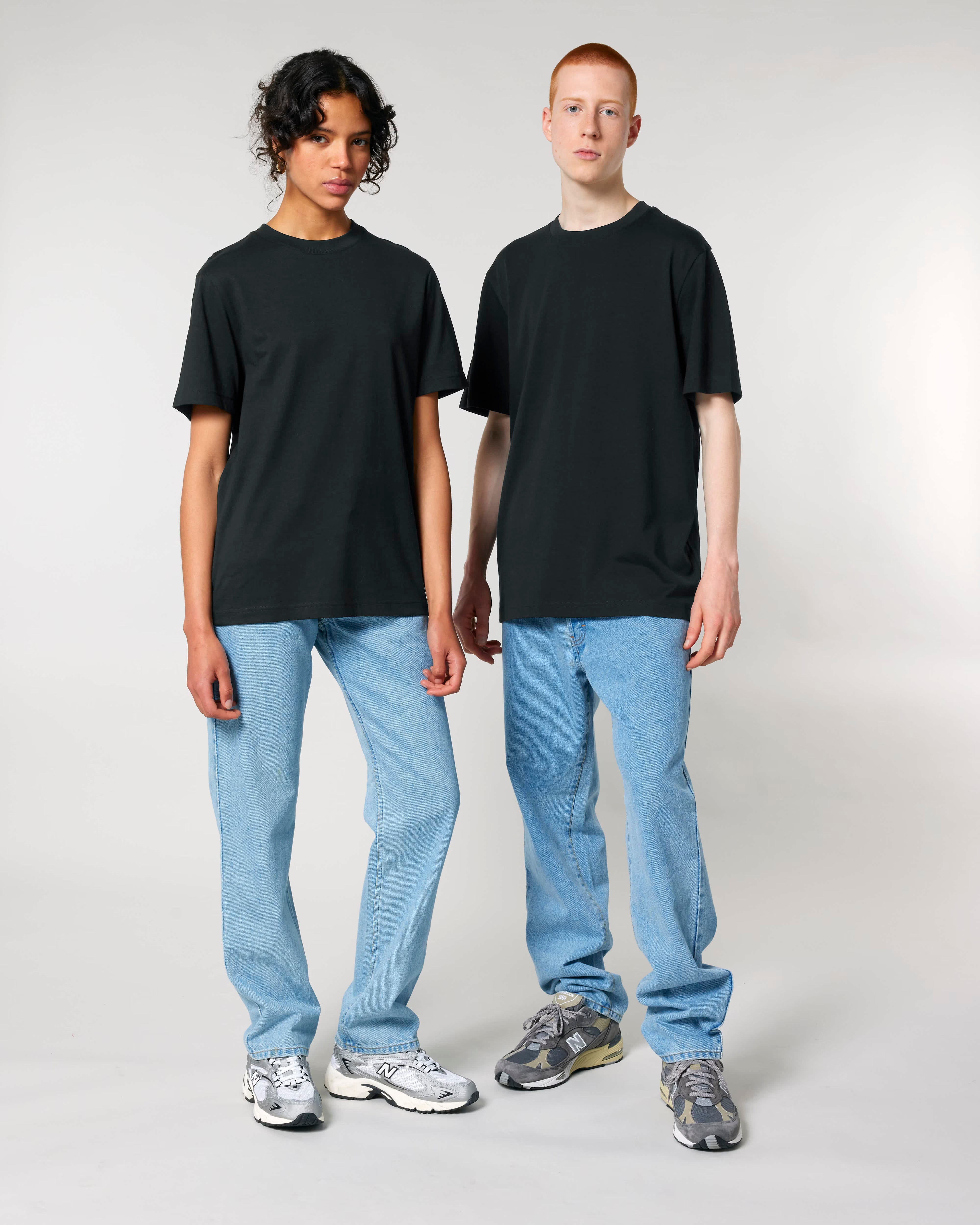 black unisex cotton t-shirt on male and female models