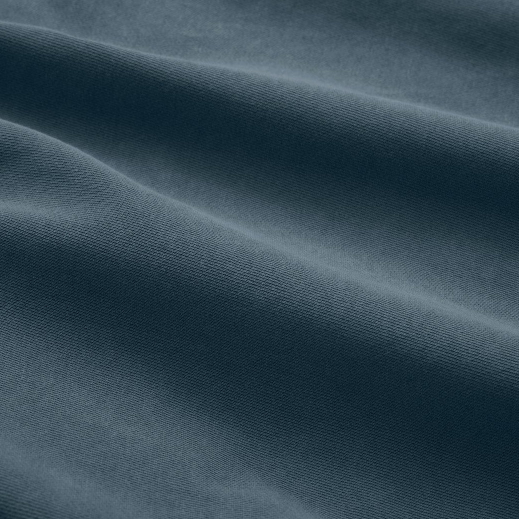 The Classic Crewneck deep teal fabric texture close-up