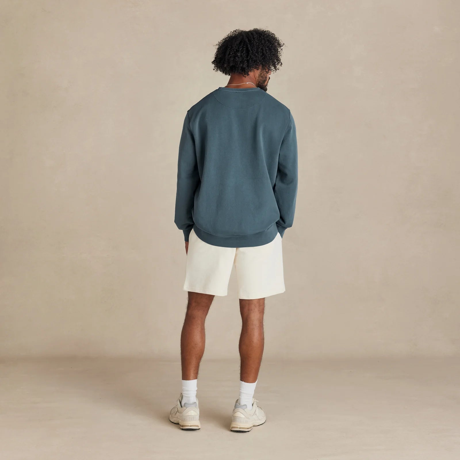 The Classic Crewneck deep teal sweatshirt worn by male model back view