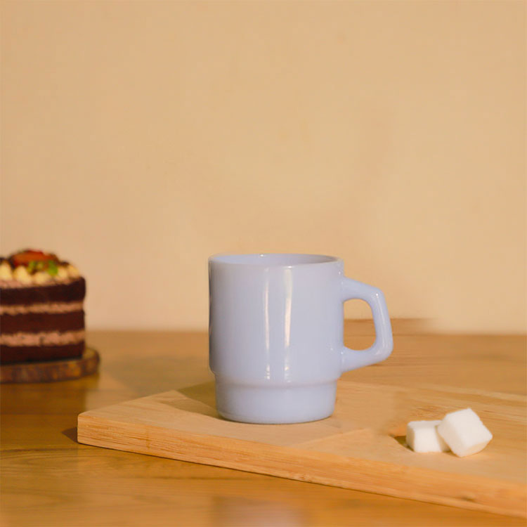 light blue ceramic mug lifestyle photo on wooden tray, custom logo merchandise