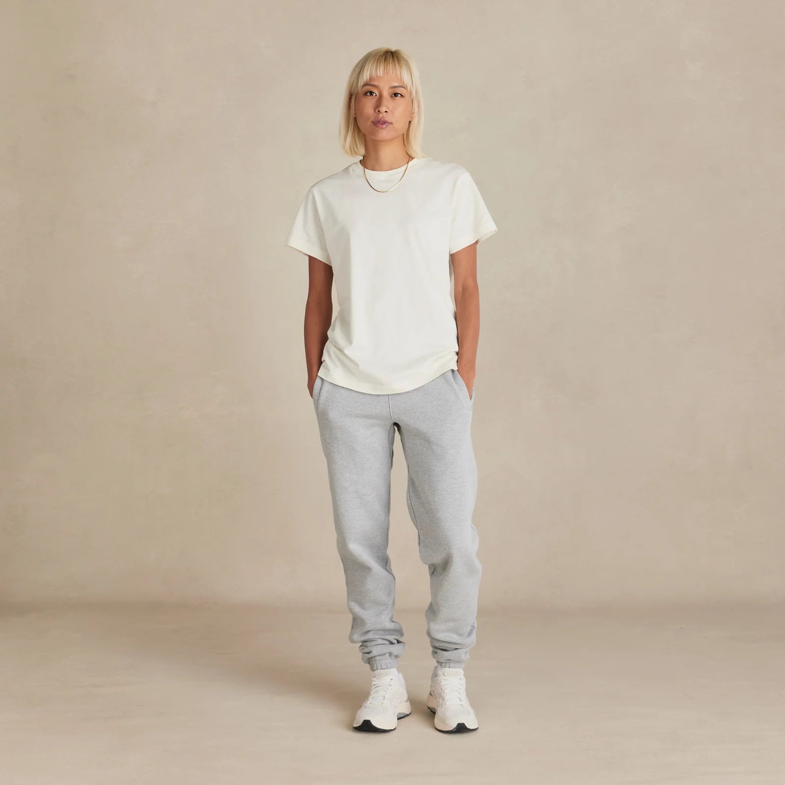 The Essential Jogger light grey sweatpants worn by female model