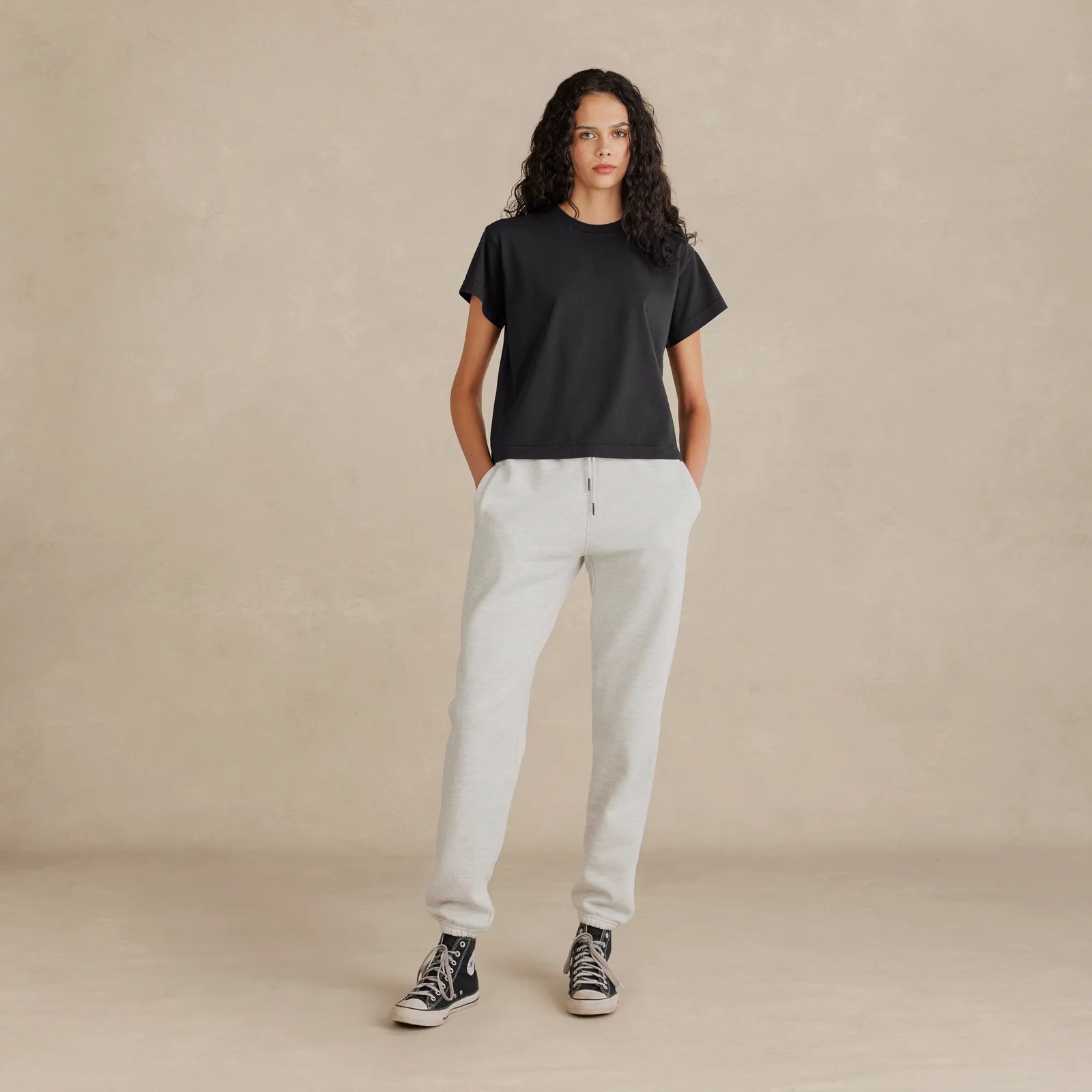 Woman wearing black Women’s Easy Fit Tee – relaxed fit, front view