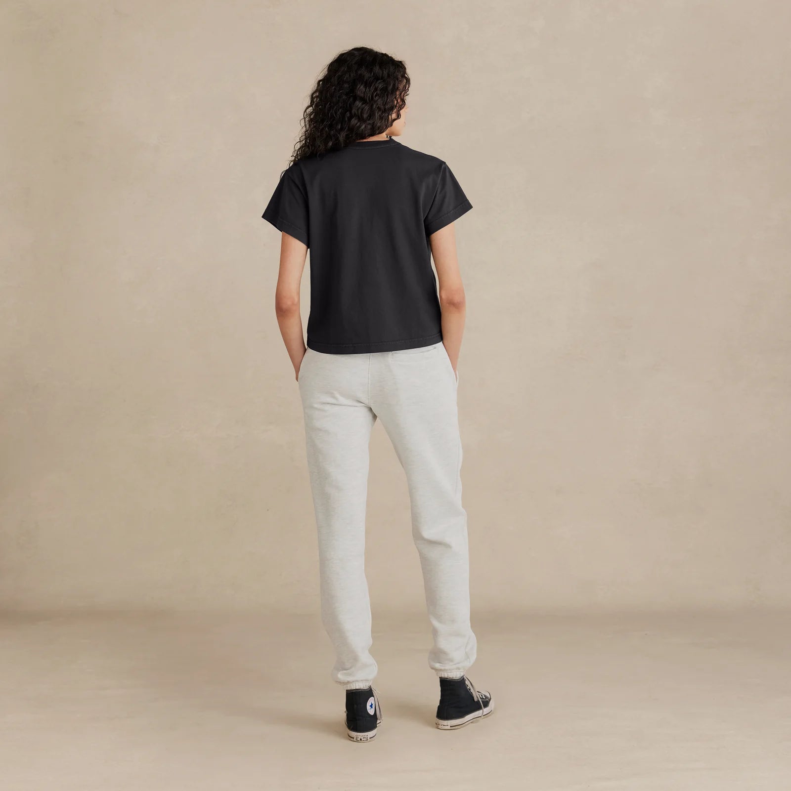 Woman wearing black Women’s Easy Fit Tee – back view