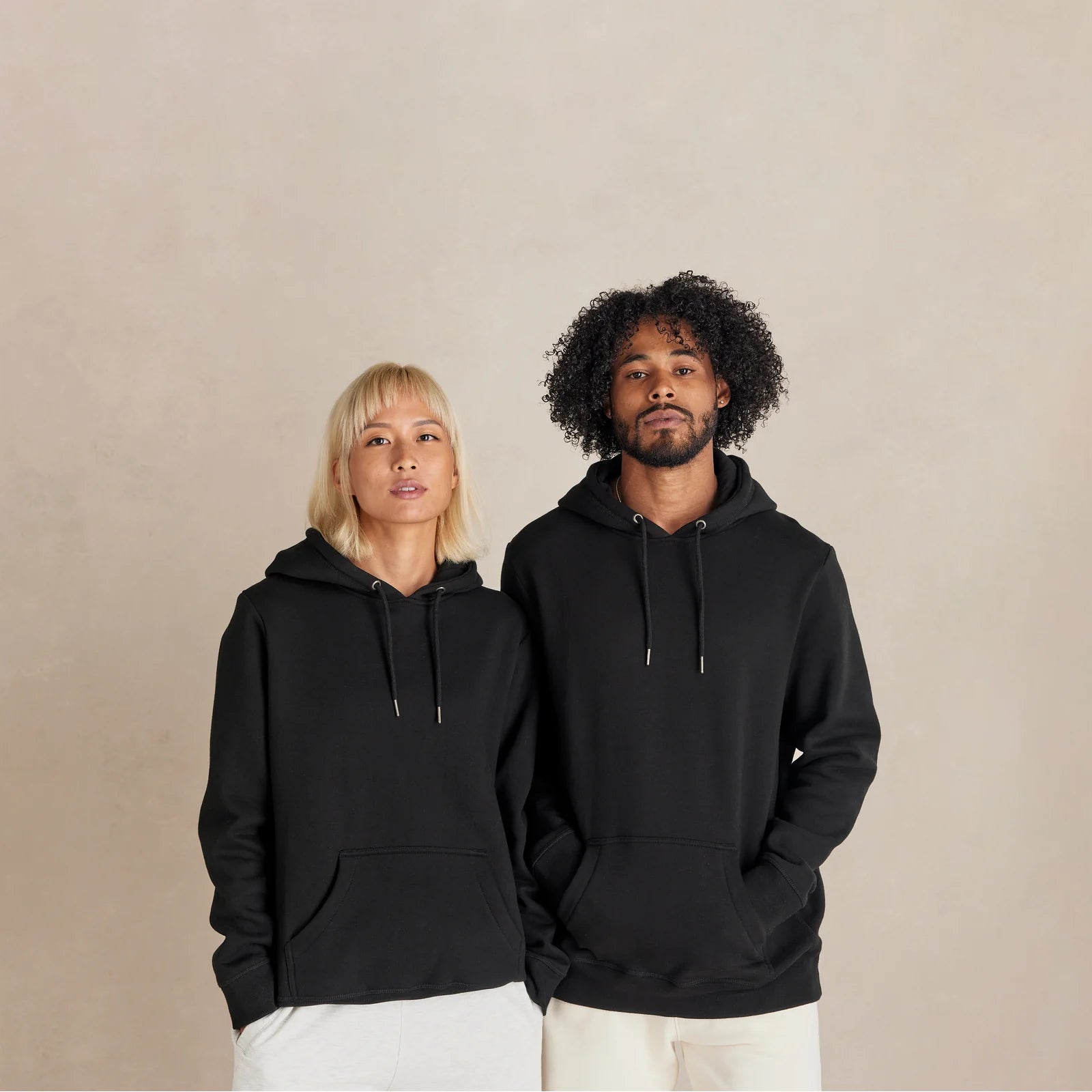 EMERCYN Essential Hoodie – black men and women premium cotton hoodie styled on male model