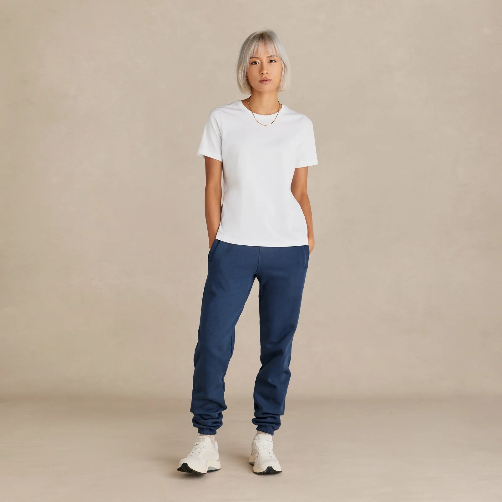 	14.	The Essential Jogger navy sweatpants worn by female model
