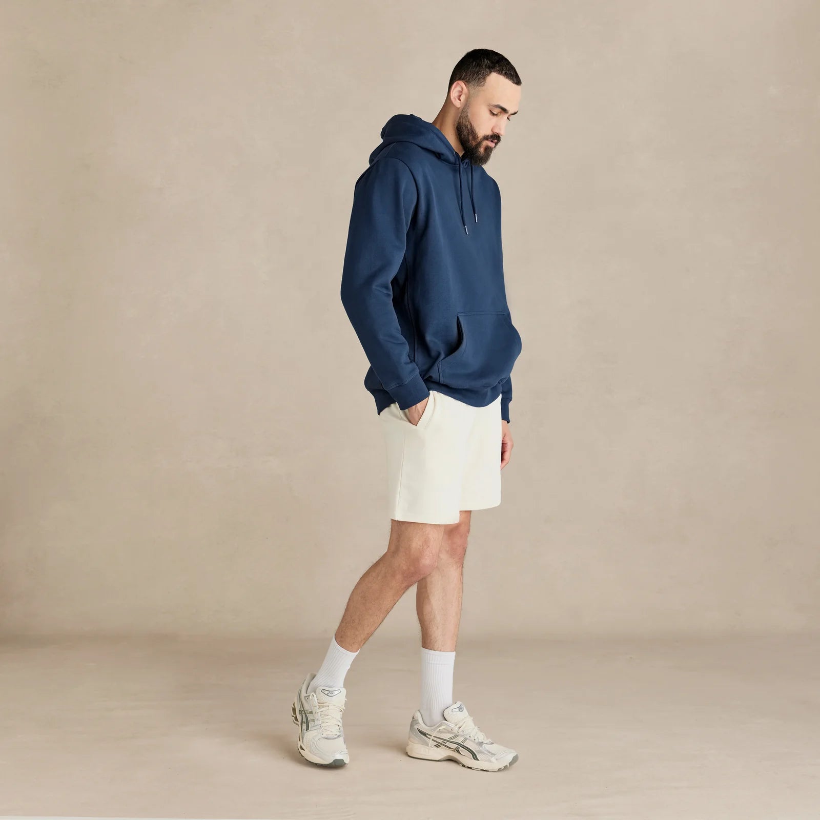 EMERCYN Essential Hoodie – navy blue men’s premium cotton hoodie styled on male model