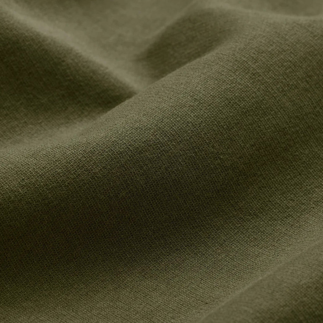EMERCYN Essential Hoodie – premium cotton fabric detail in olive green