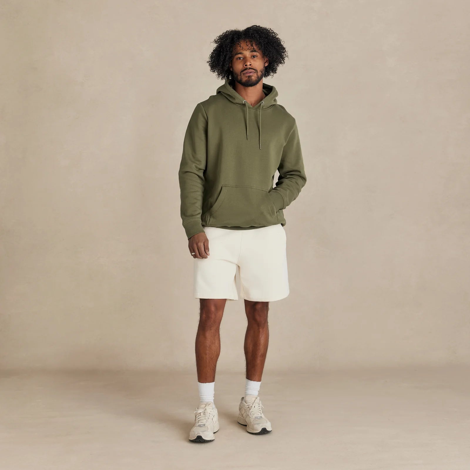 EMERCYN Essential Hoodie – olive men’s premium cotton hoodie styled on male model